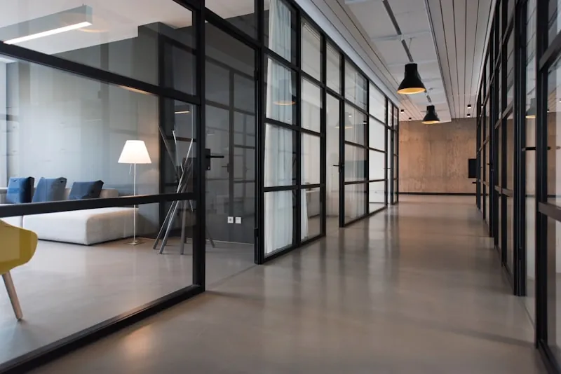 Modern office hallway with glass panel doors